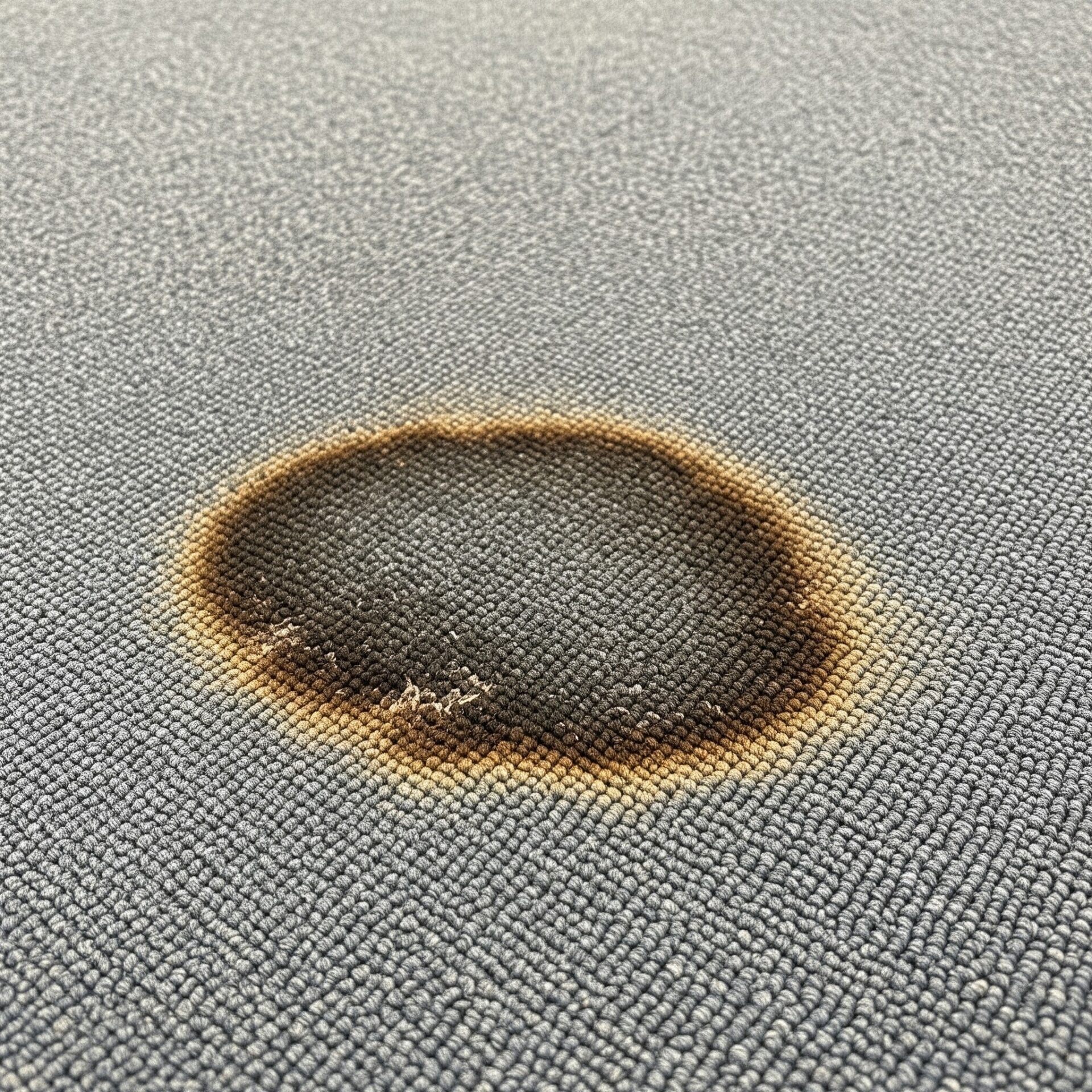 Burned carpet flooring