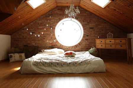 Solid hardwood flooring in a beautiful loft bedroom