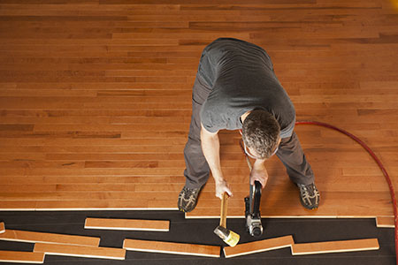 Professional hardwood flooring installation in an American home