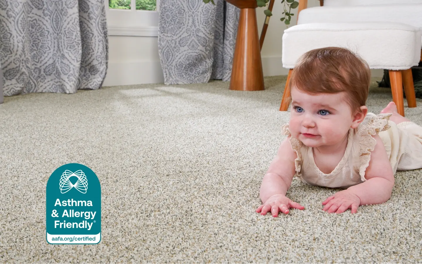 Baby crawling on soft carpet with Asthma & Allergy Friendly badge.